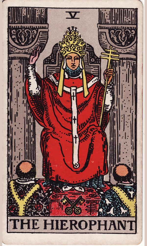 The Hierophant — a robed pontiff between two pillars, hand raised in blessing, two acolytes kneeling before him